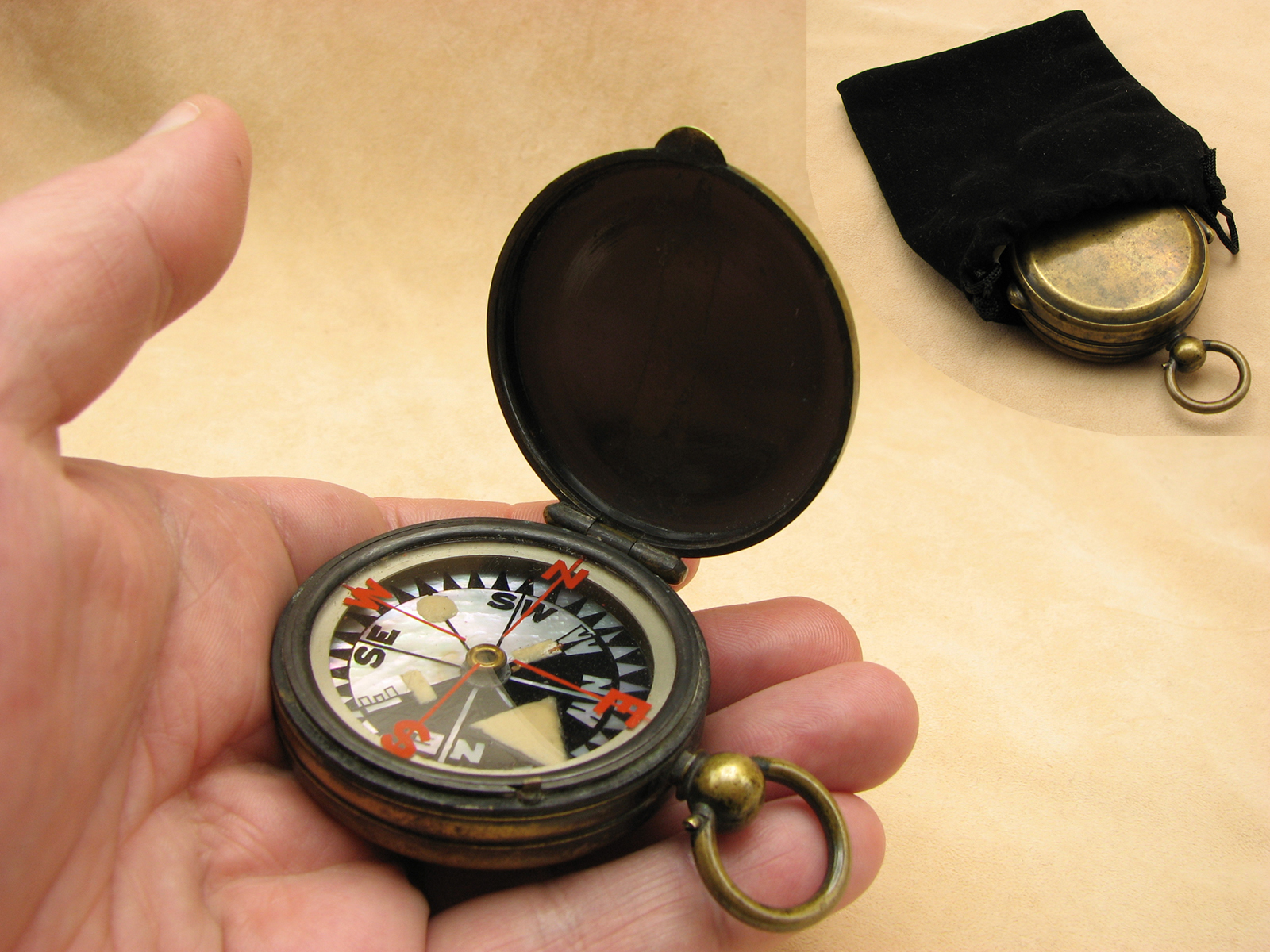 Antique brass cased pocket compass with mother of pearl dial. Circa 1900
